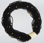 A Black Onyx and 18k Gold Tors