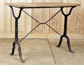 A BLACK PAINTED CAST IRON BIST