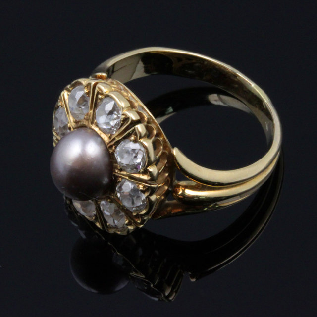 A black pearl and diamond cluster