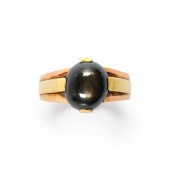 A BLACK STAR SAPPHIRE AND FOUR