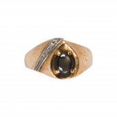 A BLACK STAR SAPPHIRE AND 14K