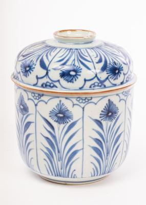 A blue and white jar and cover,