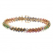 A BLUE SAPPHIRE, EMERALD, RUBY