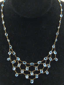 A blue topaz necklace set in yellow