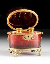 A BOHEMIAN RUBY GLASS FITTED P