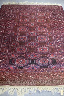 A Bokarah style rug of crimson