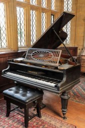 A BOUDOIR GRAND PIANO by “C. B
