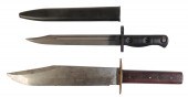 A BOWIE KNIFE with a brass hil
