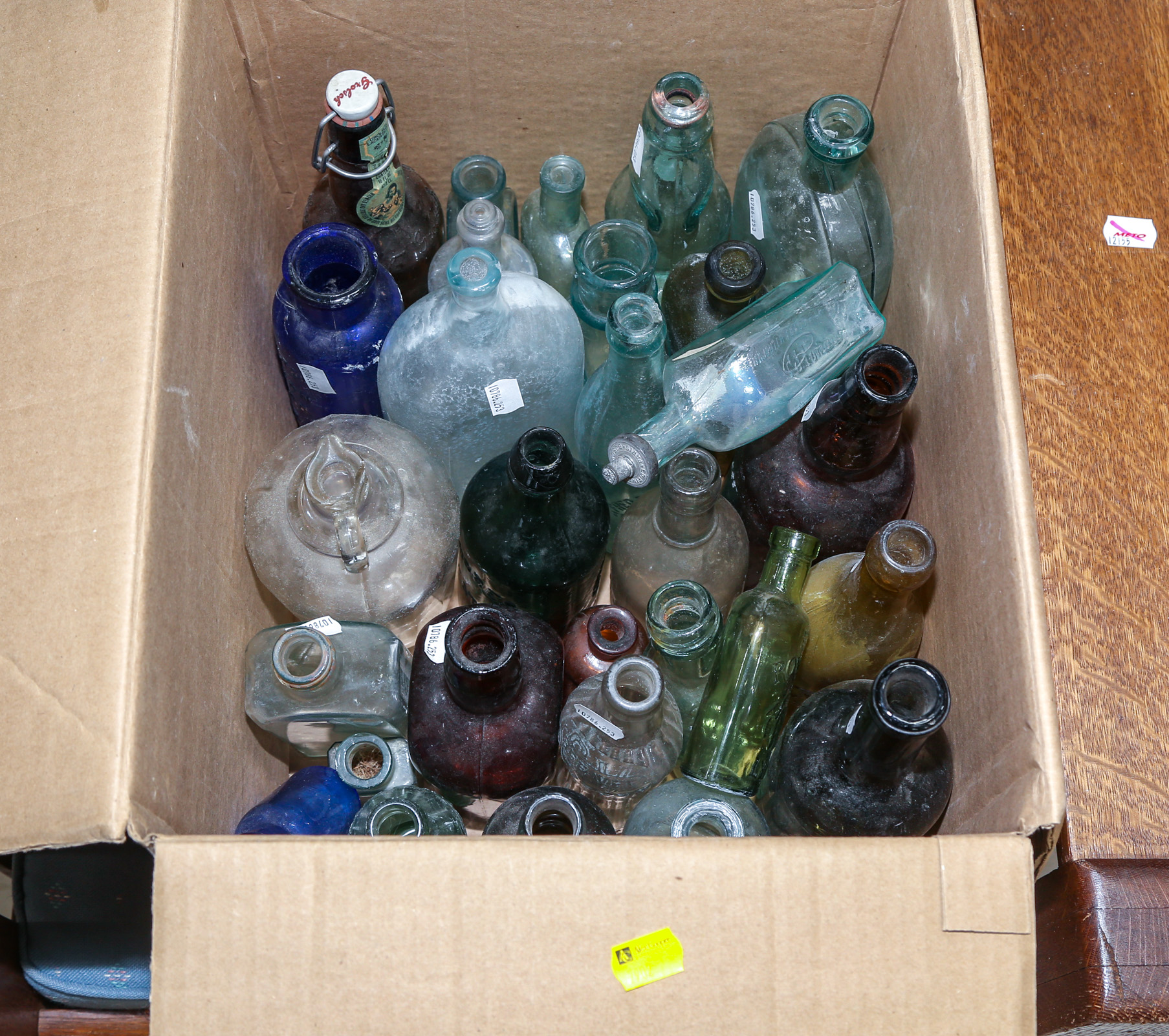 A BOX OF ANTIQUE BOTTLES