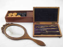 A boxed set of boxwood draughts a