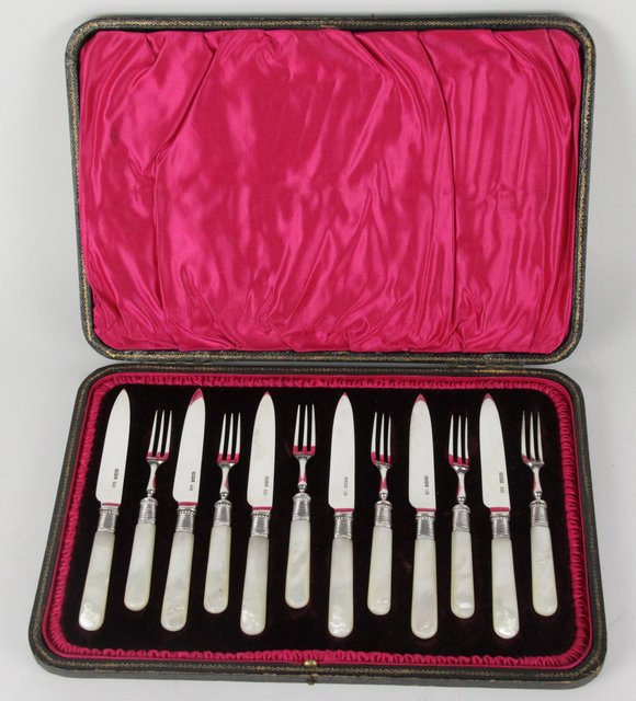 A boxed set of silver dessert