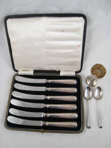 A boxed set of six silver handled