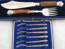 A boxed set of six silver handled