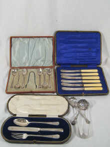 A boxed silver knife fork and spoon