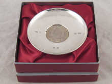 A boxed small dish commemorating