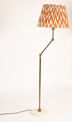 A brass adjustable standard lamp of