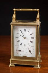 A BRASS AND BEVELED GLASS CASE