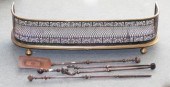 A brass and pierced steel fire