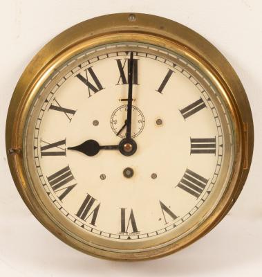 A brass bulkhead timepiece with