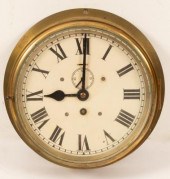 A brass bulkhead timepiece wit