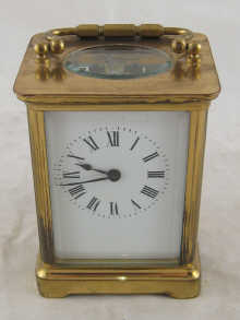 A brass carriage clock.