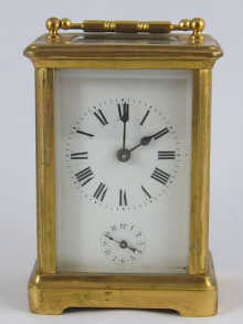 A brass carriage clock alarm