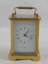 A brass carriage clock by Comi