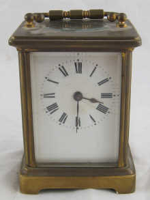 A brass cased carriage clock with