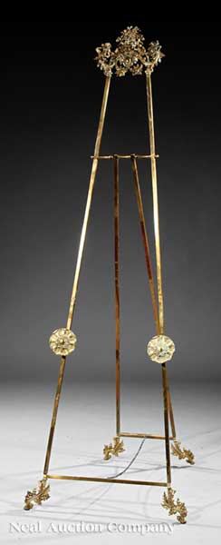 A Brass Easel crest having a flower