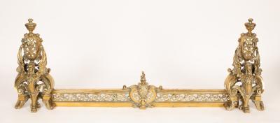 A brass fender with winged