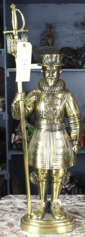 A BRASS FIGURAL DOORSTOP OF AN