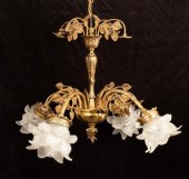 A brass four-branch scrolling