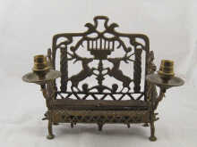 A brass hannukah modified to twin
