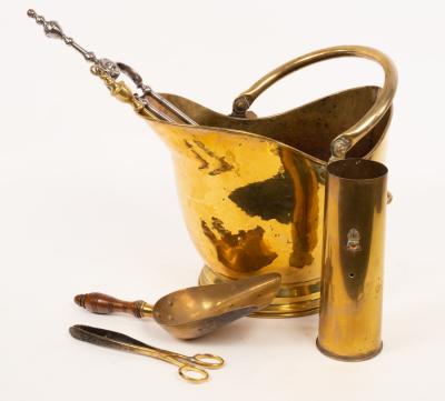 A brass helmet-shaped coal