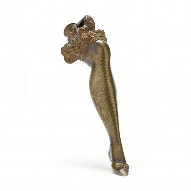 A BRASS LADY'S BURLESQUE LEG