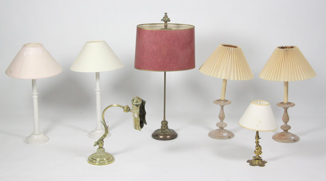 A brass lamp with floral pierced