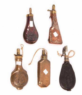 A brass powder flask embossed a