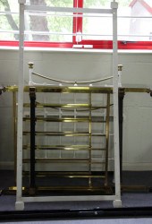 A brass rail back bedstead wit