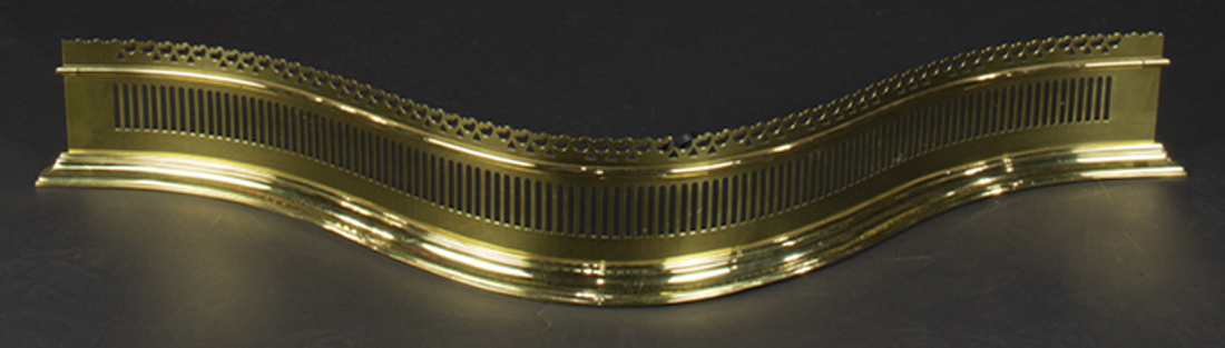 A BRASS SERPENTINE FIRE FENDER A