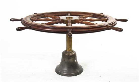 *A Brass Ship Wheel Dining Table