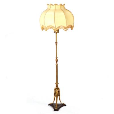 A brass standard lamp of reeded and
