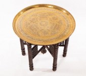 A brass topped Benares table,