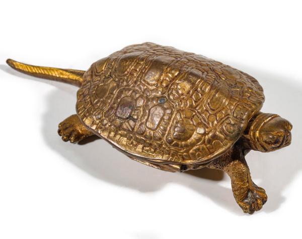 A BRASS TURTLE MATCH SAFE STRIKER