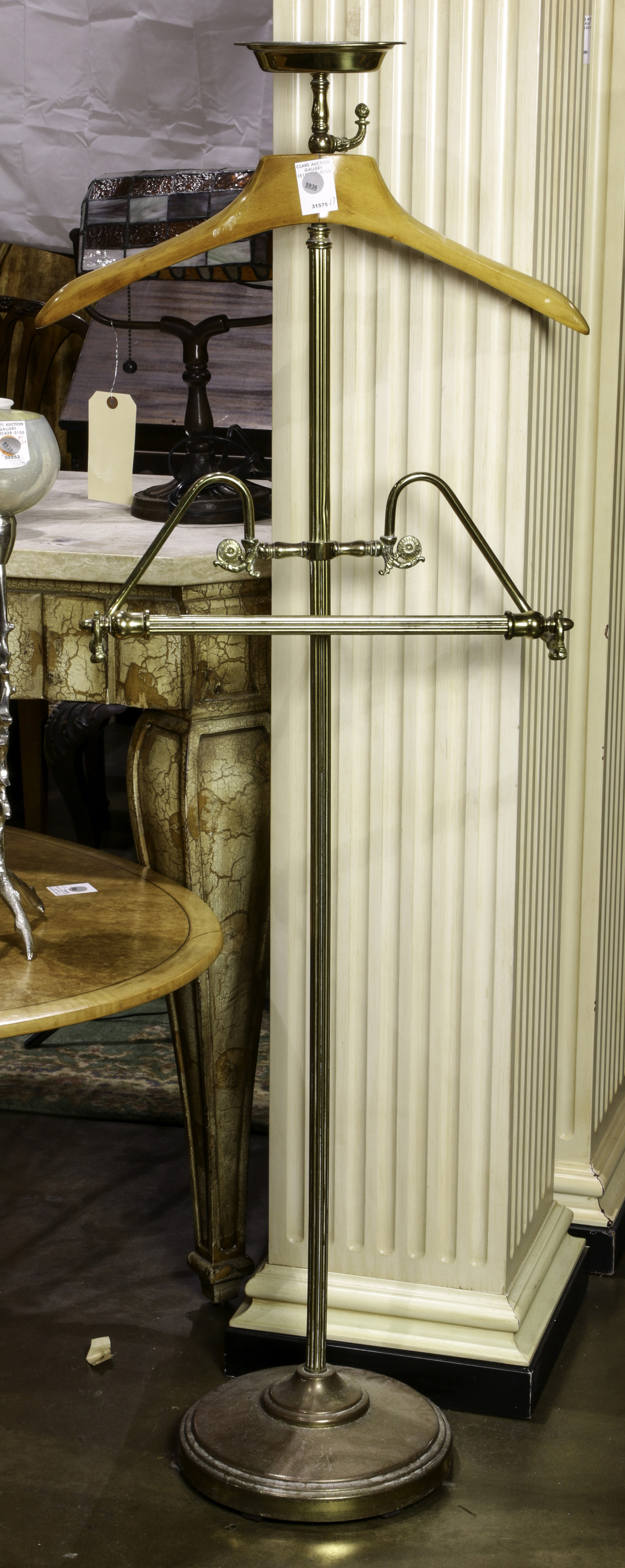 A BRASS VALET A brass valet, 52"h