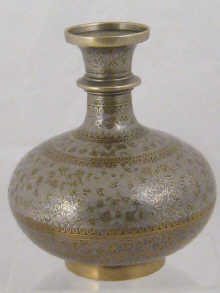 A brass vase possibly a hookah base