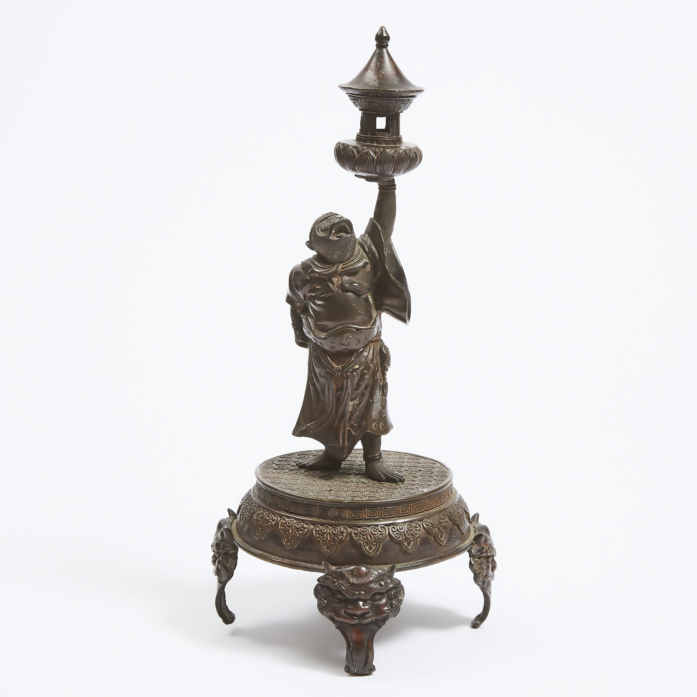 A Bronze Candlestick of the