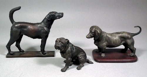 A bronze figure of a seated bulldog