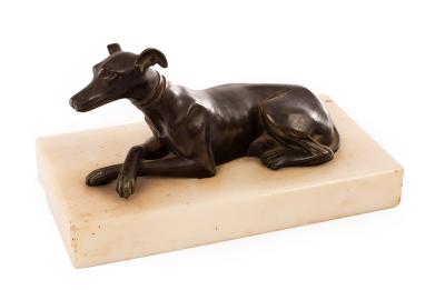 A bronze figure of a recumbent