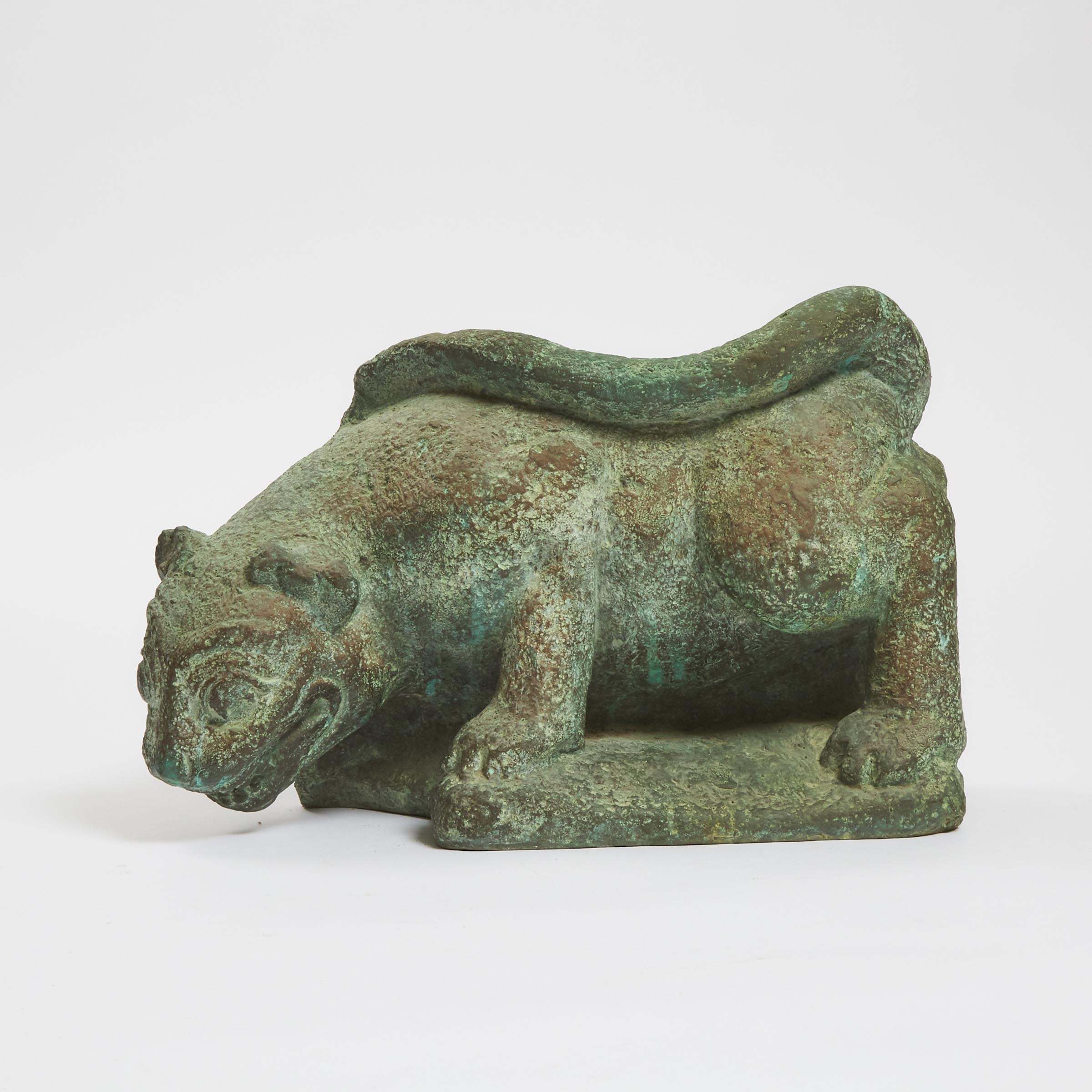 A Bronze Figure of a Recumbent