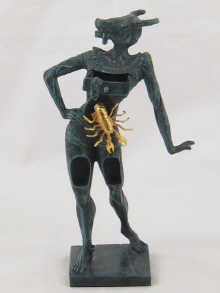 A bronze figure with animal head